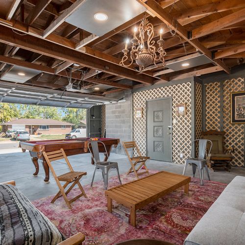 The converted garage is now a swanky lounge with a pool table, perfect for fun gatherings.