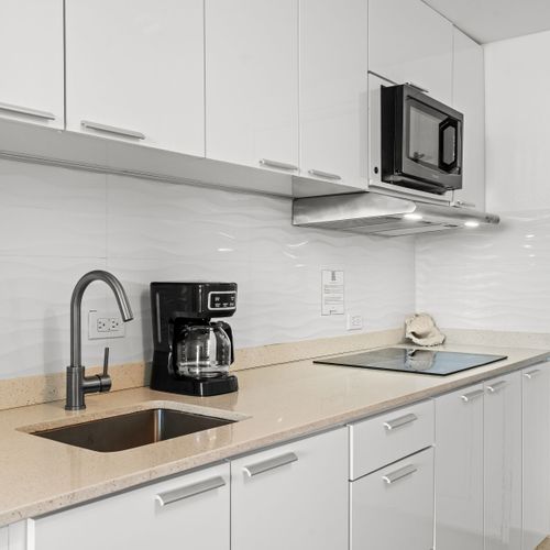 Bright and airy studio offering panoramic ocean vistas from your bed and a functional kitchenette for your convenience.