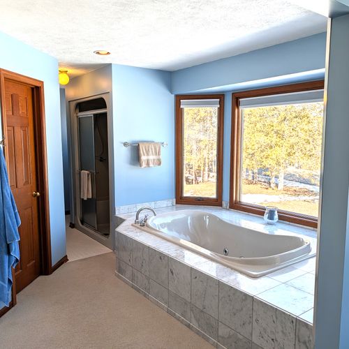 BATHROOM #2 (SECOND FLOOR):  This is a large private ensuite full bathroom for Bedroom #2.  Features a gorgeous jetted bathtub with a great view of Big Platte Lake from the bathtub!
