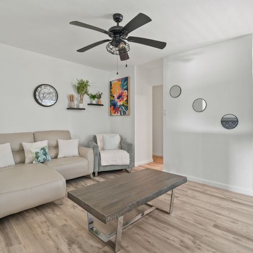 An inviting lounge with stylish furnishings and a sofa.