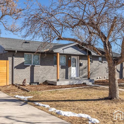 The house features a large driveway that fits 3-4 cars.