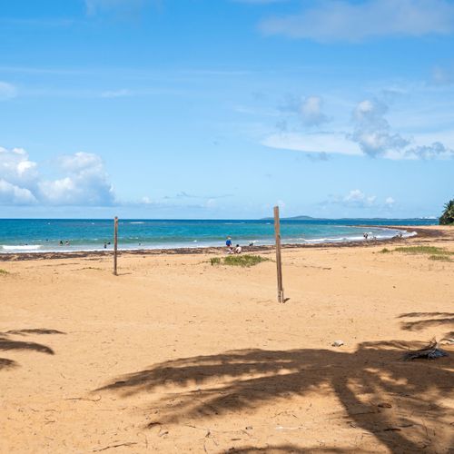 Your Private Slice of Paradise: This breathtaking beach view is just moments from your door – an idyllic setting for sunbathing, swimming, and unforgettable sunsets.