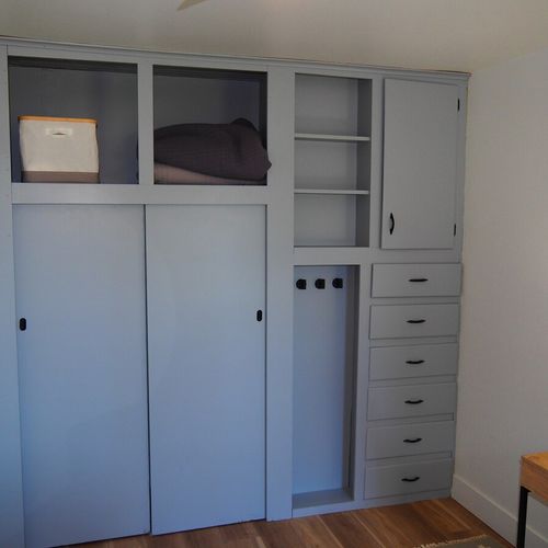 Bedroom #2:  features a queen-size bed, nightstands, desk, and a large wall closet.