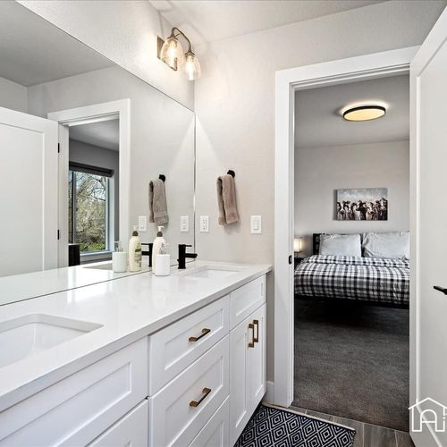 Direct access to the jack-and-jill bathroom makes this room a great choice for guests and offers plenty of storage.