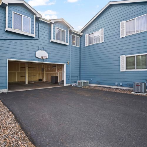 Enjoy secure parking and basketball hoop for casual fun