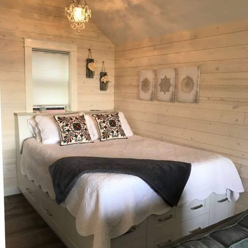 Enjoy the view from this queen size bed with custom built platform with plenty of drawers.