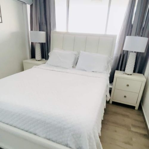 Bedroom with a View: Indulge in ultimate relaxation in this elegantly appointed bedroom, offering an unparalleled ocean backdrop.