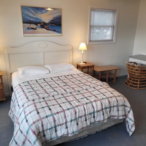 Bedroom #2 (upper level):  features a queen-size bed, great views of lake michigan, dresser, mirror, closet, desk, and private en suite full bathroom!