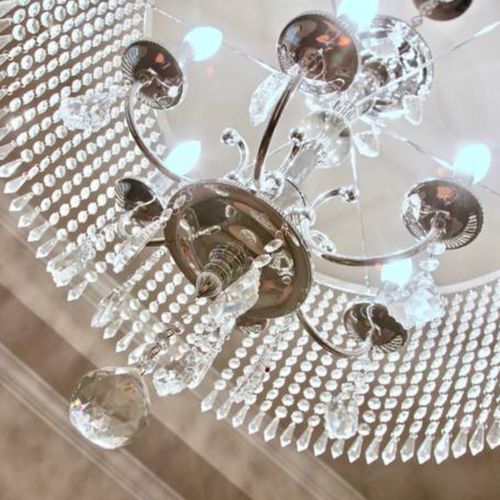 Sparkling chandelier adding a glamorous touch to the space.