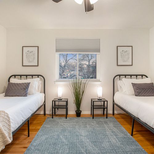 Upstairs bedroom with two twin beds.