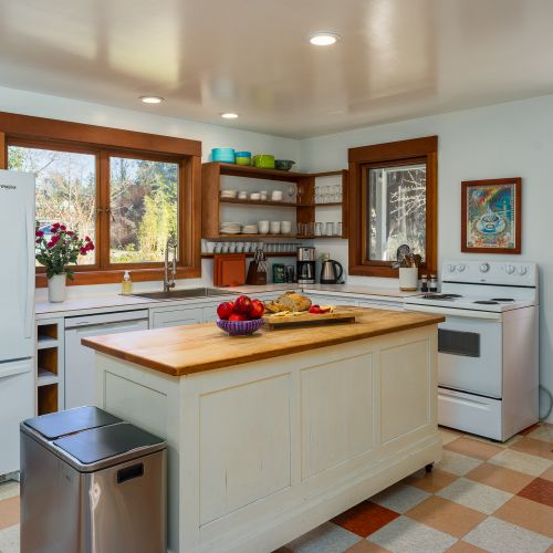 Country kitchen with plenty of counter space and coffee bar.