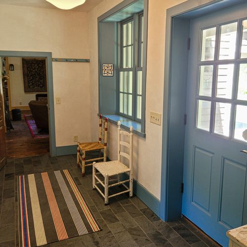 Charming blue trim leads you into the entryway