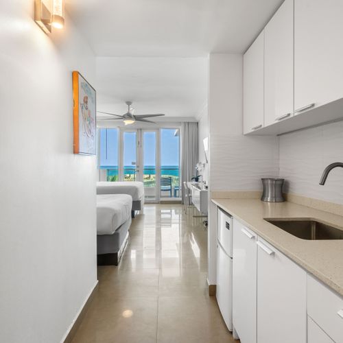 Stunning ocean view studio with direct balcony access and a convenient kitchenette. Experience comfort and breathtaking scenery.