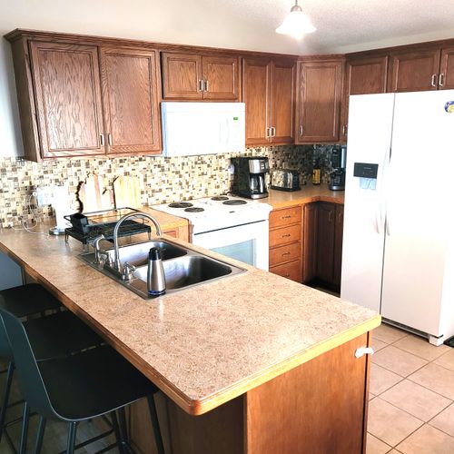 KITCHEN:  The home has a cute and modern kitchen with all appliances, except for a microwave and a dishwasher.