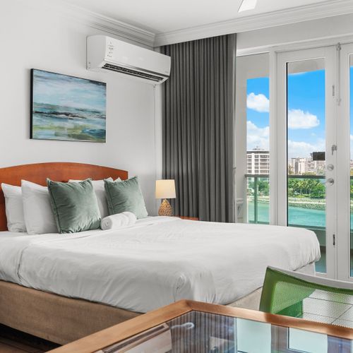 Experience pure comfort on this generously sized bed, adorned with soft pillows and a calming ambiance.