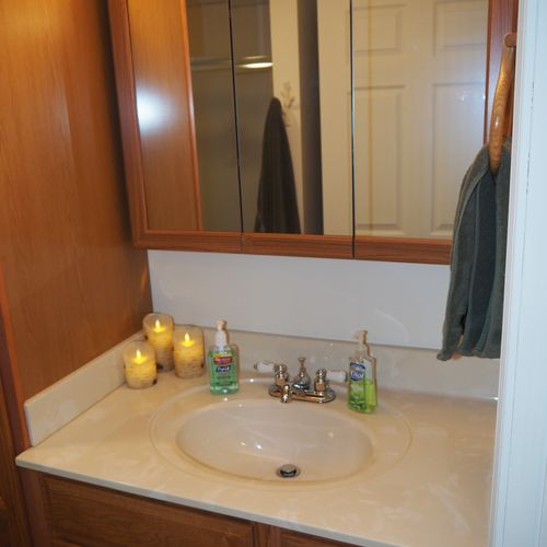 Bathroom:  full bathroom with a walk-in shower as well as a stacked washer and dryer.
