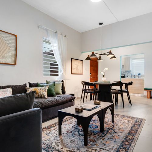 An inviting social area with a beautiful wood dining table.