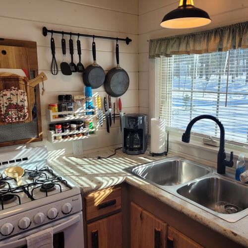 Kitchen:  the cabin has a cute little kitchen with all appliances except for a dishwasher. Includes a good supply of cooking and dining utensils as well.