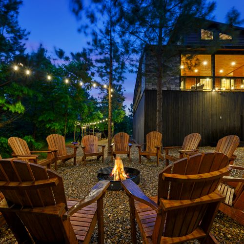 Fire pit with Adirondack chairs.