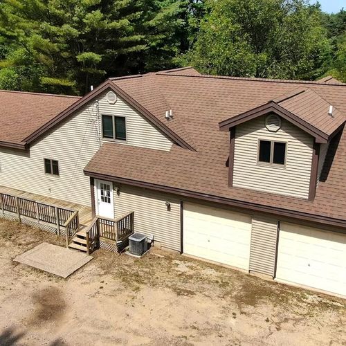 Exterior:  aerial photo highlighting the parking area and the 2-car garage, which is available for guests to use.