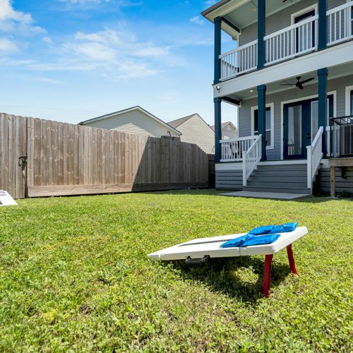 Spacious backyard w/ cornhole & a sun-drenched lawn made for gatherings & good times.