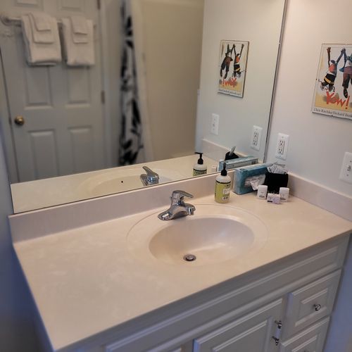 Bathroom #2 (upper level):  full bathroom that is a private en suite bathroom for bedroom #2