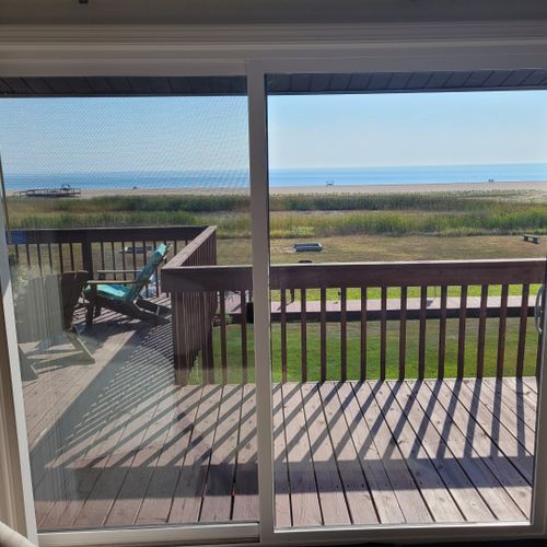 Living room:  the view of lake huron and the private beach from the living room.