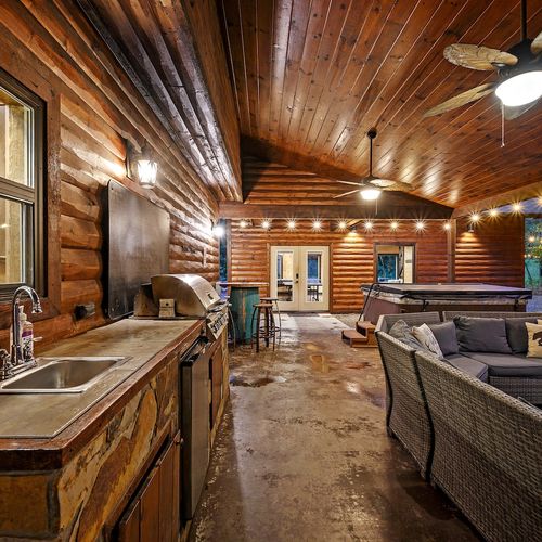 Outside kitchenette with gas grill, sink, mini fridge and more!