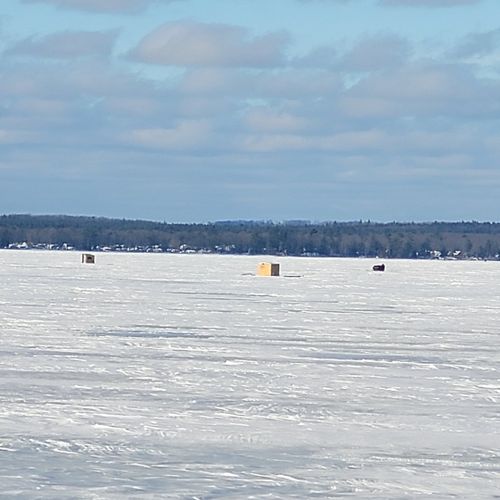 Exterior:  ice fishing at higgins lake. The lake is quite popular for ice fishing.
