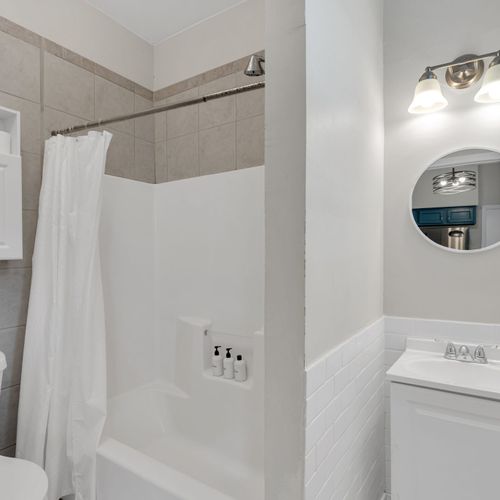Clean, fresh bathroom w/ a shower & tub combo for a refreshing rinse.