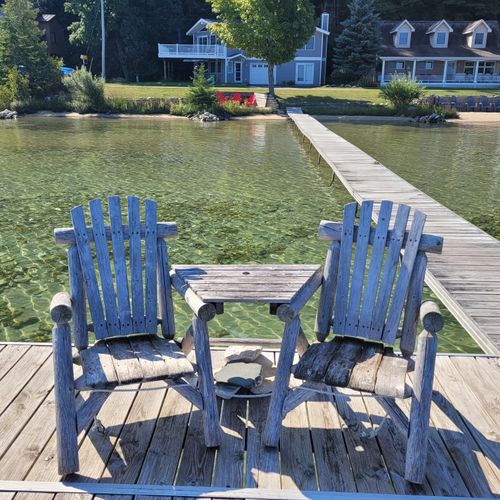 EXTERIOR:  The fun Adirondack chairs on the dock that are great for looking out over Crystal Lake.