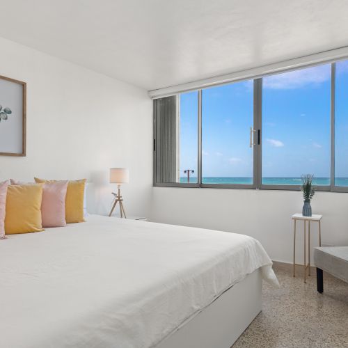 A large window allows natural light to flood the room, creating a bright and airy feel.
