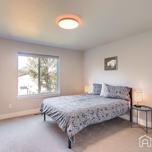 This bright and welcoming second bedroom features lovely views, a quiet place to retreat after a full day of activities.