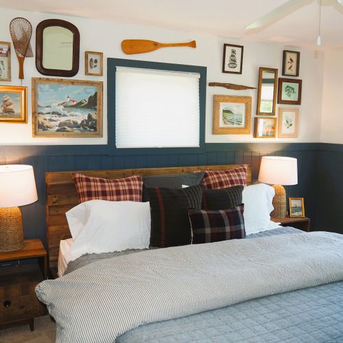 Bedroom #1 (main floor):  features a king-size bed, private en-suite bathroom, ceiling fan, shelves, and great views of the backyard, long lake, and sleeping bear dunes.