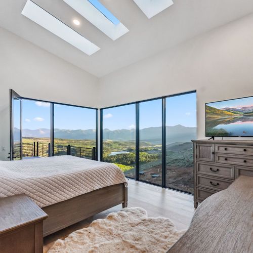 Cozy queen bed, calming atmosphere, and windows that frame stunning views.