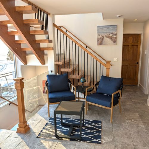 DINING AREA (MAIN FLOOR):  The home has a gorgeous dining area with a spectacular view of Crystal Lake!