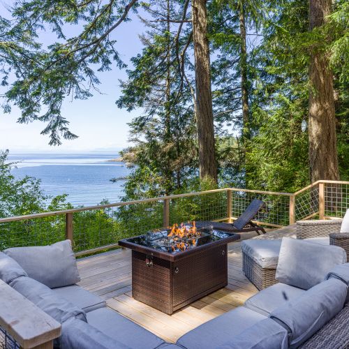 Surrounded by large, old fir trees, the deck is a gem for fair-weather lounging.