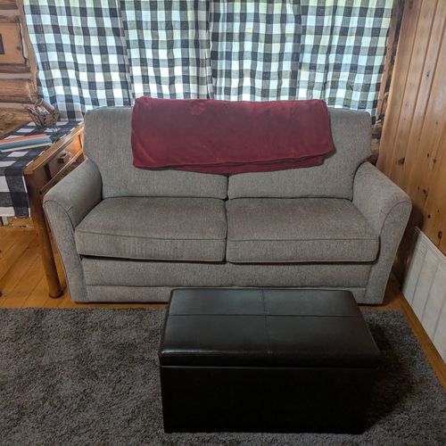 Living area: the couch in the living area, which folds out into a double bed as well.