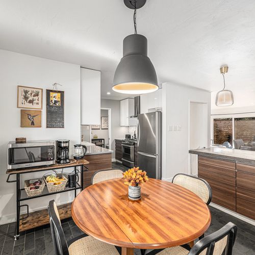 Bright and inviting breakfast nook just off the kitchen, offering a perfect spot for casual meals or enjoying a quiet moment.