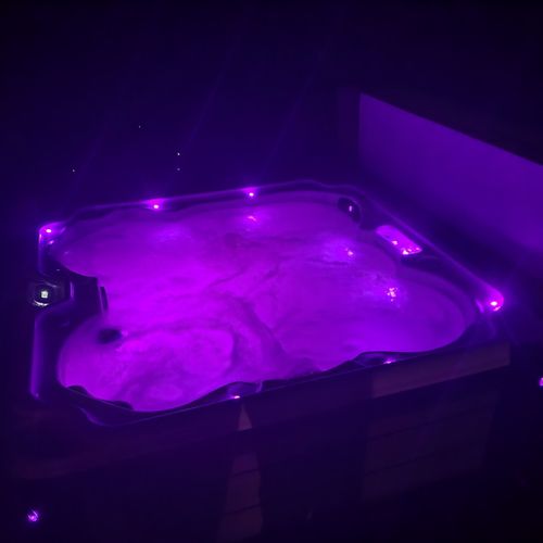 Exterior:  the hot tub can be easily changed to multiple different romantic colors at night.