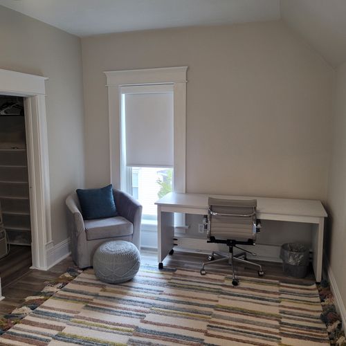 Bedroom #3 (second floor):  features a queen-size murphy bed, window a/c unit, ceiling fan, desk with chair, comfy chair, and a closet.