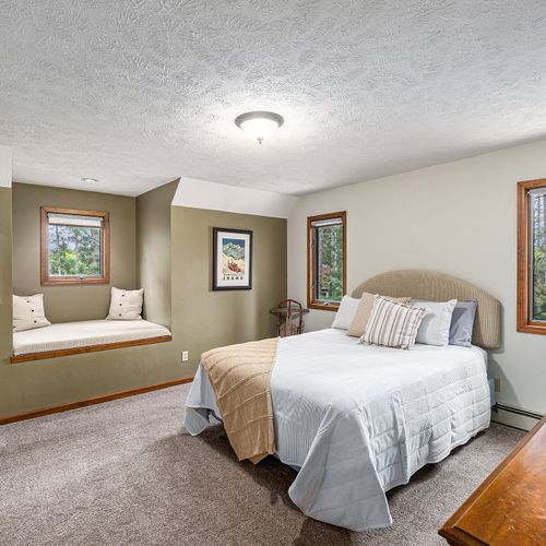BEDROOM #2 (SECOND FLOOR):  Super cute bedroom with a queen-size bed, cubby area, closet, dresser, and mirror.