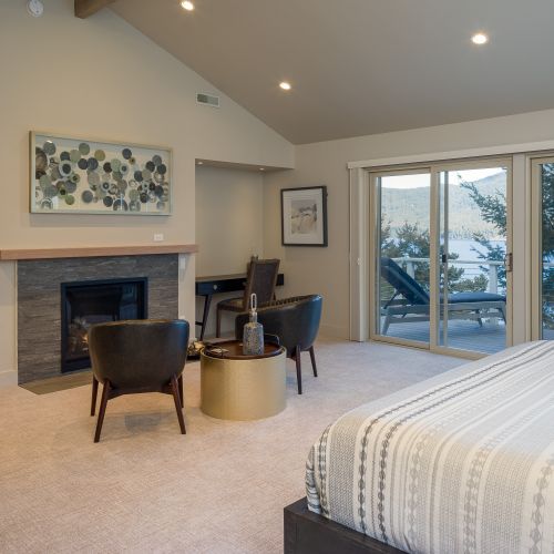 Main Suite includes a walk-in closet, reading area, remote work desk, and beautiful custom-tiled bathroom.