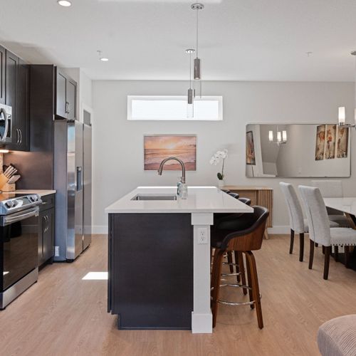 Open-concept kitchen with stylish finishes—perfect for group gatherings.