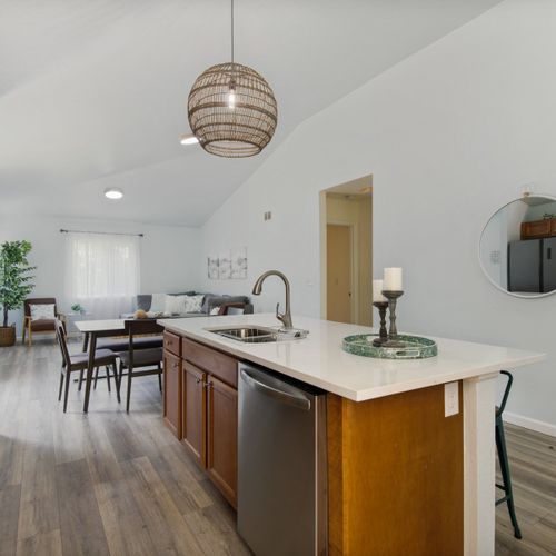 The renovated modern kitchen is fully equipped with new appliances and provides a perfect space for preparing meals during your stay.
