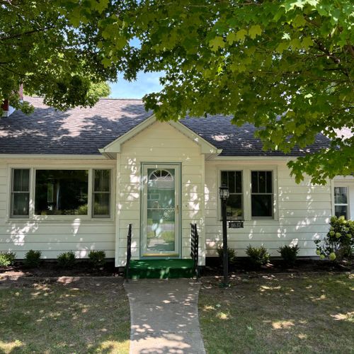 Overall:  the front of the house in summer