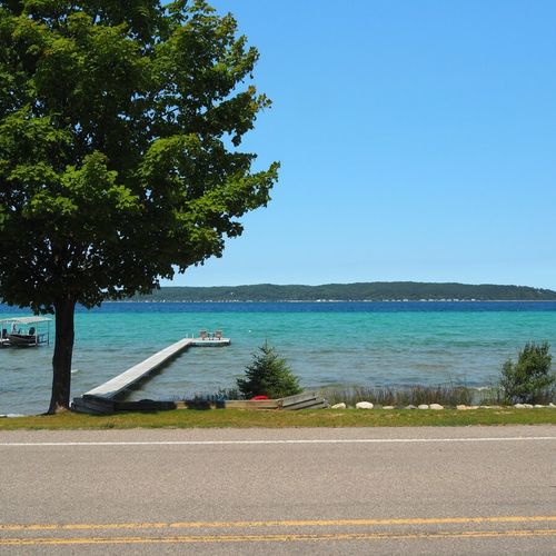 Exterior:  looking out at the lake from the front yard. (note that south shore drive runs between the house and the lake. )