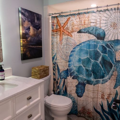 Simple modern shower with smooth finishes, echoing the home’s effortless beach style.