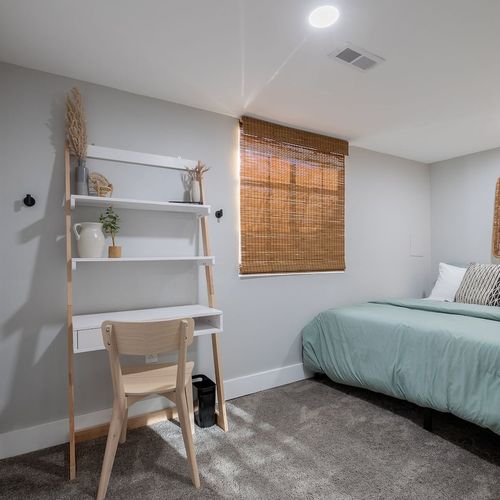 - enjoy peaceful nights in a cozy bed with woven textures and soft lighting
- work or study from a sleek ladder desk surrounded by natural décor elements
- bamboo blinds and earthy tones create a calm, grounded vibe throughout