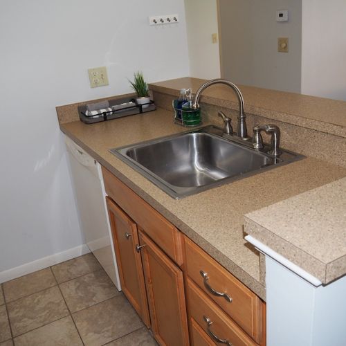 Kitchen:  the condo has a convenient and efficient full kitchen with all appliances including a dishwasher. A good collection of cooking and dining utensils is also included with the rental.